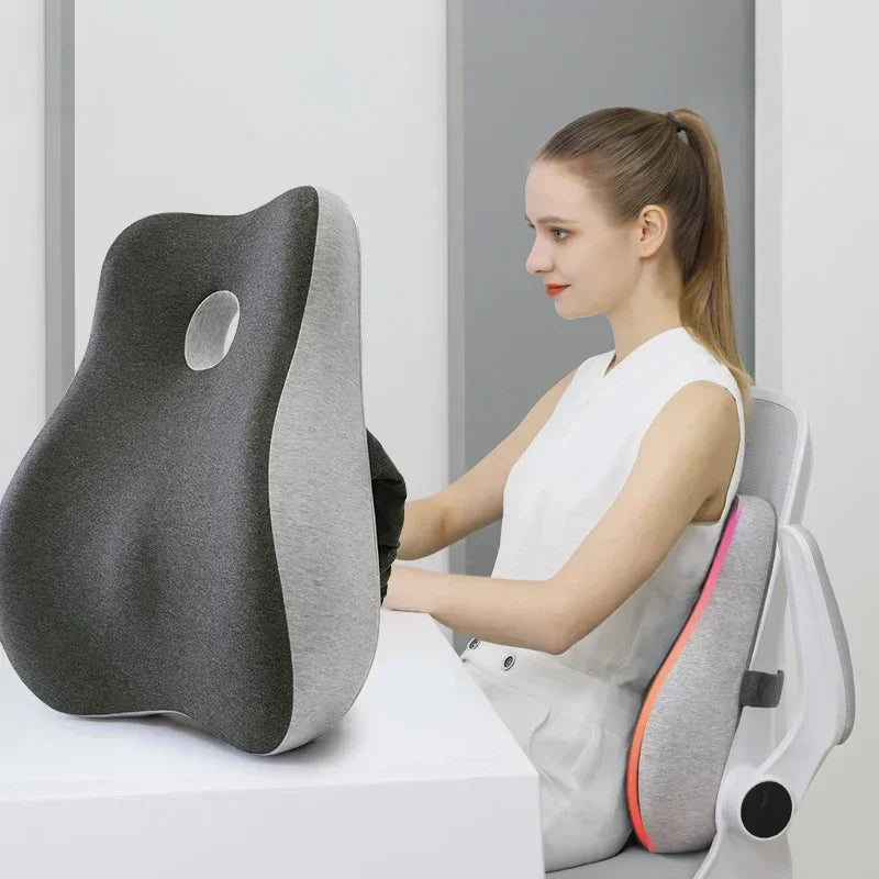 Woman sitting comfortably in an office chair using the Seat and Back Support Cushion in Solid Gray